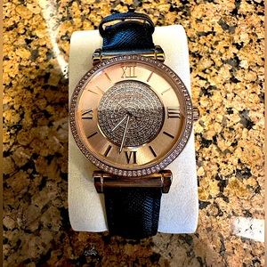 Michael Kors gold watch with cubic zirconia face and black leather band